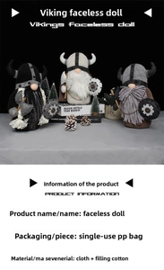 Detailed view of handmade Viking Gnomes in black, white, and brown with small axes and shields