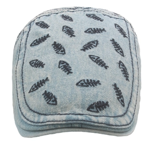 Close-up of light blue washed denim newsboy cap with black fishbone embroidery detail