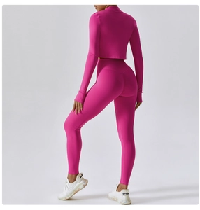 Rear view of rose pink high-waisted yoga leggings and long sleeve cropped gym top