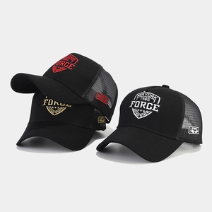 Detail of mesh trucker hats with New York 1985 embroidery and breathable netting
