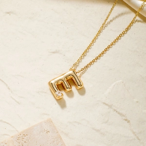 Minimalist gold bubble letter E pendant necklace with star zircon on fine chain