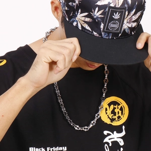 Hip hop style geometric link chain necklace in gunmetal finish on male model