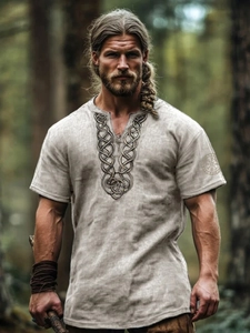 Detailed view of the Celtic knot embroidery on the linen collar of a Viking style shirt