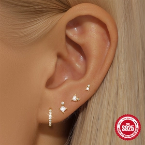 S925 sterling silver gold earrings set with cubic zirconia on female model ear