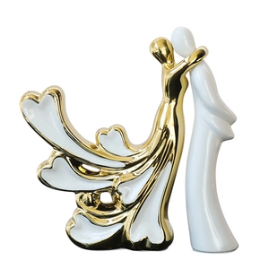 Figurine de couple abstraite en céramique avec finition dorée et détails de glaçure blanche