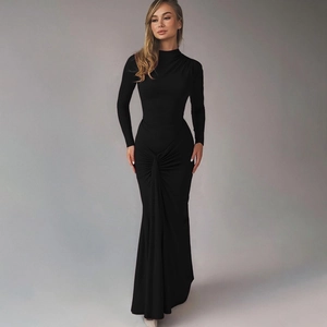 Detailed view of black slim fit dress featuring elegant waist pleats and mermaid hemline