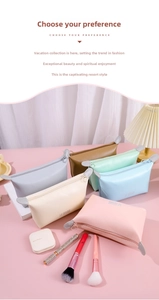 Macro shot of stylish PU leather dumpling cosmetic bags in various pastel colors