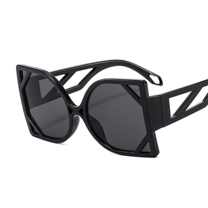 Fashionable oversized cat-eye sunglasses with geometric hollow temples in black