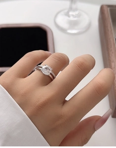 Close-up of a 2ct 925 silver bridal ring set with six-prong carbon diamond and micro pave band