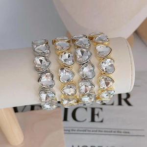 Sparkling heart-shaped rhinestone bracelet available in gold and silver finish options