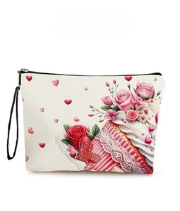 Close-up of heart-shaped cake and floral print on a canvas Valentine cosmetic bag