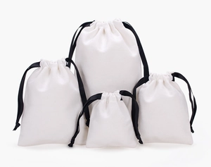 Detailed comparison of four different sizes of white cotton drawstring storage pouches