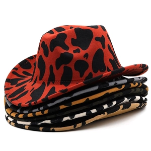 Detailed stack of multi-color thick felt western cowboy hats with cow patterns