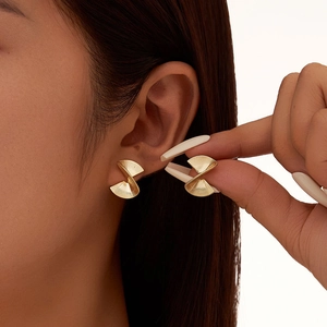 Punk style irregular spiral fan leaf stud earrings in gold plated finish for women