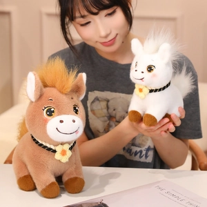 Cute plush pony dolls in brown and white with decorative flowers and woven ropes