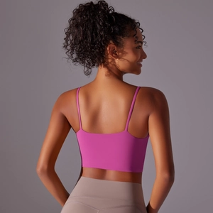 Detail of cross-back straps on pink-purple high-impact sports bra for women