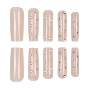 Press on nails set in nude coffin shape decorated with iridescent AB rhinestones