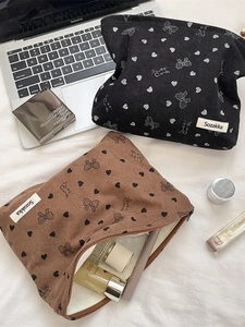 Large corduroy makeup bags with heart and bow patterns in black and brown colors