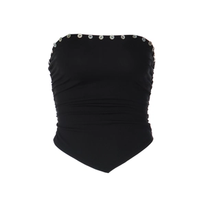 Détail d'un haut bustier noir avec des boutons décoratifs en coquillage clair sur le bord supérieur