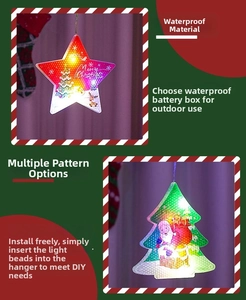 Detail of LED Christmas curtain lights with painted Santa, snowman, and DIY hanging stars