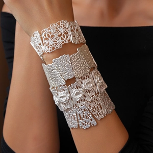 Close-up of matte silver irregular hollow flower bracelets set with various textures