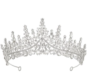 Detailed view of silver crystal crown with sparkling rhinestones and intricate wave patterns
