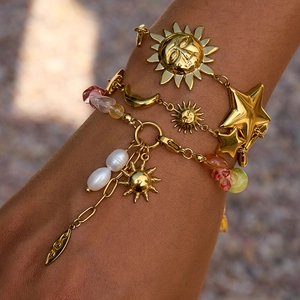 Celestial gold layered bracelet set with sun moon star charms and pearl beads