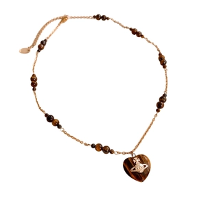 Vintage heart tiger eye beaded necklace with golden orb logo on white background