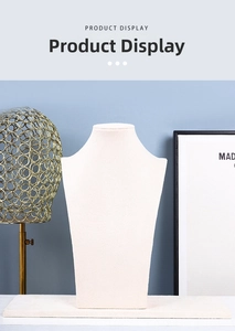 Detailed view of beige velvet bust and flat tray for jewelry display set
