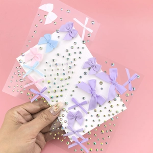 Close-up of colorful butterfly rhinestones and pearls for facial makeup and nail art
