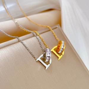 Minimalist D-letter pendant necklaces in gold and silver finish with zircon rings
