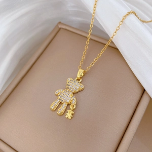 Elegant gold titanium steel necklace featuring a sparkling pavé crystal teddy bear pendant