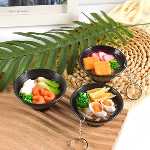 Realistic PVC Japanese Udon and Ramen noodle bowl keychains on rustic wood display