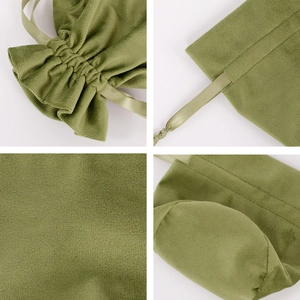 Detail view of green velvet drawstring pouch showing ribbon tie and round bottom texture