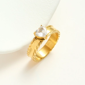 Elegant gold-plated heart zircon ring with textured band shown on a white display
