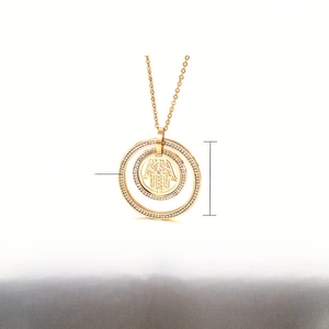 Detail of 39mm golden stainless steel Hamsa Hand pendant necklace with dimensions and weight