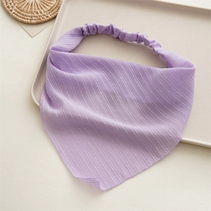 Detail of lavender pleated chiffon headband with white polka dots and elastic band