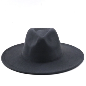 Detailed close-up of a black wide-brimmed wool felt jazz hat with smooth finish