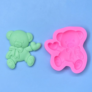 Cute teddy bear silicone mold holding a heart for DIY cake baking and crafts