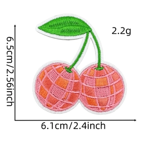 Detailed view of cherry embroidery patch showing 6.5cm x 6.1cm size and grid texture