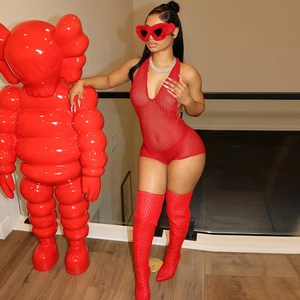 Red mesh halter neck bodysuit with sexy cutout design on a fashion model