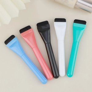 Flat top foundation brush set in five colors arranged on a minimalist background