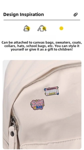 Detail of pink enamel brooches with healing quotes on canvas bag and sweater
