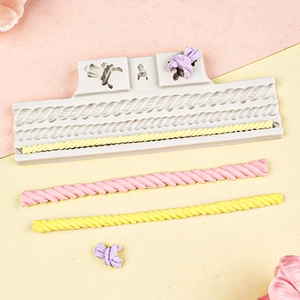 Macro shot of silicone mold featuring rope textures and bow patterns for cake borders
