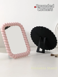 Detail showing smooth rounded corners and adjustable folding stand of the makeup mirror