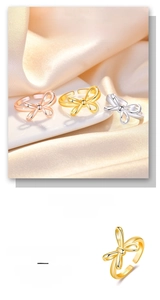 Macro detail of S925 sterling silver bow rings in gold, rose gold and silver finishes