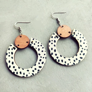 Modern bohemian wood drop earrings with black and white leopard dots and silver hooks