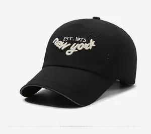 Detail of embroidered EST. 1975 New York text on black breathable mesh baseball cap