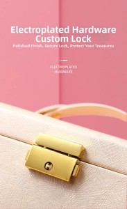 Macro detail of high-quality light gold electroplated lock on pink crossgrain leather box