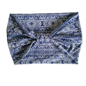 Detail view of Bohemian blue headband with white geometric patterns and knot design